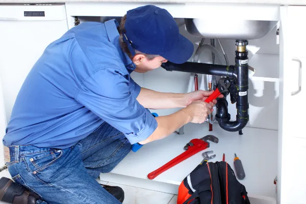 a male plumber fixing a toilet from Emergency Plumber Plano in Plano, TX a male plumber fixing a toilet from Emergency Plumber Plano in Plano, TX