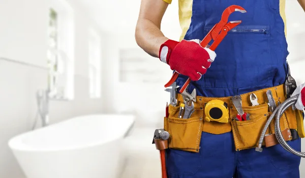 the torso of a plumbing technician showing a tool belt in Plano, TX - Tankless water heater Installation